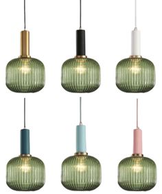 six green glass pendant lights hanging from the ceiling