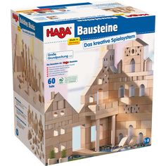 a wooden model of a castle in the box