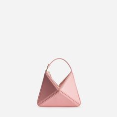 Our architectural, origami-inspired Flex Bag is now available in mini size. This compact and convertible design sits perfectly on your shoulder or in the palm of your hand. Handcrafted from Italian calf leather, it features a suede top with zip closure, and a detachable shoulder strap. It is roomy enough for the essent Modern Triangle Shoulder Bag For Evenings, Modern Triangle Shoulder Bag For Evening, Geometric Leather Shoulder Bag For Evening, Triangle Leather Evening Bag, Leather Triangle Evening Bag, Geometric Leather Evening Bag, Elegant Geometric Leather Bags, Chic Geometric Leather Bag, Geometric Evening Bag