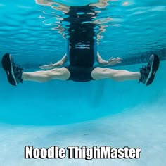 a man swimming under water with his feet up in the air and texting noodle thighmaster