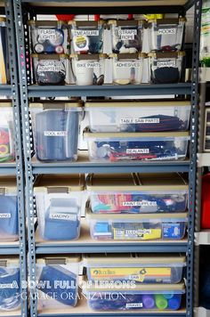 the shelves are filled with plastic containers and bins for organizing items, such as books