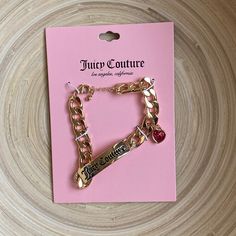 Juicy Couture Gold Bracelet This Bracelet Makes A Statement. Literally!! You’ll Make A Statement Too, Wearing A Classy Bracelet Like This On Your Wrist. + Features: Thick Gold Chain, Curved Bar With “Juicy Couture” Written On It, Lovely Pink Heart Charm, Lobster Claw Closure With Extender New With Tag! Pink Chunky Chain Jewelry For Party, Trendy Pink Chain Bracelet With Adjustable Chain, Trendy Pink Adjustable Chain Bracelet, Trendy Pink Chunky Chain Jewelry, Pink Chain Bracelet As A Gift, Juicy Couture Bags Handbags, Pink Jewerly, Maching Tattoos, Thick Gold Chain