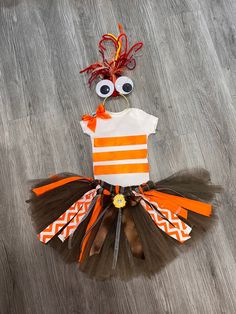 Inspired by Anxiety Character  includes stripped Orange Shirt, Fluffy Sassy brown  Tutu with Brown Satin Bow and Yellow button or Flower and headband with google eyes and crazy hair that's might  changes due to inventory.  Ready to Ship ! The costume is inspired by Anxietys fun costume   comes with a hand tied TUTU that is super full and fluffy,  perfect for twirling and laughter.  Comes with a large  Bow and yellow flower or button  and ribbon streamers a Orange and white vinyl stripped shirt a Tutu Size Chart, Ribbon Streamers, Google Eyes, Brown Satin, Orange Shirt, Large Bow, Satin Bow, Crazy Hair, Yellow Flower