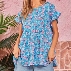 Emily Wonder By Andree Bt Unit Floral Tiered Blouse. Size M Nwt 100% Polyester Printed Blue Tops, Summer Blue Blouse With Relaxed Fit, Printed Blue Tops For Daywear, Blue Printed Tops For Daywear, Blue Floral Print Short Sleeve Tops, Blue Ruffled Relaxed Fit Top, Light Blue Short Sleeve Blouse For Beach, Blue Short Sleeve Blouse For Vacation, Blue Relaxed Fit Summer Blouse