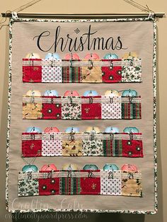 a christmas banner hanging from the wall with presents on it's front and back