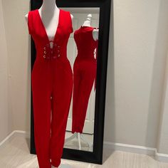 Janet Corset Style Skinny Leg Jumpsuit. Red Color. Has Two Pockets And A Back Zipper. The Front Has A Lace And It Ties. New With Tag. Stretchy Material. Inseam Is 30. Size S. Red Fitted V-neck Jumpsuit, Red Trendy Jumpsuits And Rompers For Party, Trendy Red Jumpsuits And Rompers For Party, Red Trendy Party Jumpsuits And Rompers, Trendy Red Jumpsuit For Party, Red Sleeveless Jumpsuit For Night Out, Red Fitted V-neck Jumpsuits And Rompers, Red V-neck Fitted Jumpsuit, Trendy Fitted Red Jumpsuits And Rompers