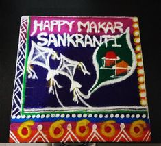 this is an image of a happy makar sankrarati cake on display