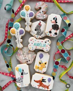 some decorated cookies are laying on a table