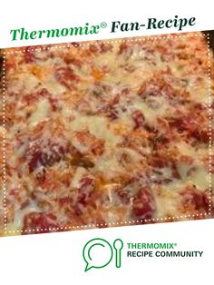 there is a large pizza with many toppings on the top and bottom, as well as an ad for thermomiia fan - recipe