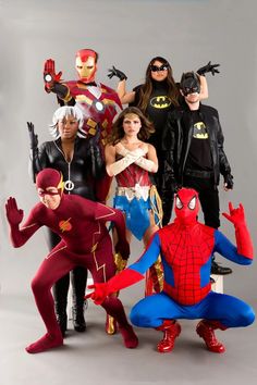 a group of people in costumes posing for a photo