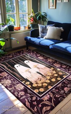 a living room with a blue couch and rug