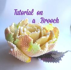 a beaded flower sitting on top of a table