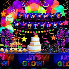 a birthday party with balloons, cake and decorations