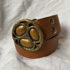 "You are looking at a genuine tan leather belt with two tone brass buckle. Belt measures 38\"2 long with 29\"7 from the first perforation and 36\"7 at it's last perforation from buckle and 1\"6 wide. The condition of this belt is good and is made of tan leather with great detail in buckle. The leather belt is thick and strong and there was a last perforation on end and the buckle is custom made. ------------------------------------I SHIP WORLDWIDE------------------------------------------------- Tan Leather Belt, Brass Buckle, Buckle Belt, Shopping Tote Bag, Perfect Bag, Signature Logo, Tan Leather, Leather Belt, Leather Shoulder Bag