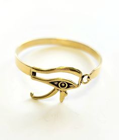 Eye of Horus Semi-Cuff - MINU Jewels Adjustable Hinged Gold Bangle, Adjustable Symbolic Gold Cuff Bracelet, Gold Symbolic Bangle Cuff Bracelet, Symbolic Gold Bangle Cuff Bracelet, Adjustable Gold-tone Brass Cuff Bracelet, Adjustable Gold-tone Metal Cuff Bracelet, Hinged Metal Cuff Bracelet As Gift, Adjustable Hinged Metal Cuff Bracelet, Horus Design