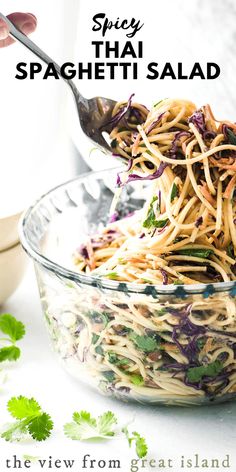 a bowl filled with noodles and garnished with parsley