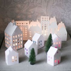 small paper houses and trees on a table