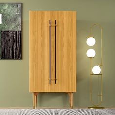 a tall wooden cabinet next to a lamp