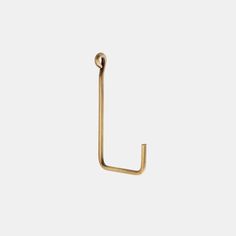 an open brass hook on a white background