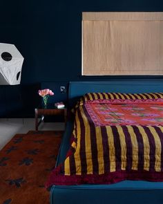 a bed in a room with blue walls