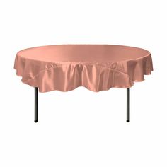 a round table with a pink cover on it