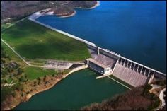 an aerial view of a dam and lake