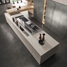 a modern kitchen with an island counter top