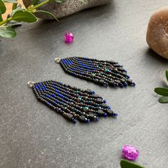 These punk gothic black, iridescent and blue fringe earrings are lightweight and stunning. These cute, beaded dangly earrings with stunning colour and design would make a very thoughtful birthday, anniversary, Valentine gift for her, gift for wife, mum, girlfriend, sister  Material: Seed beads handwoven using durable thread. Technique: Brick stitch and fringe Ear wire: You can choose between ear hooks, leverback, stud and clip-on fittings. I offer a choice of finishes including sterling silver 925, gold-plated, golden and silver-colour fittings to suit most needs.   Dimensions: The length stated includes the handmade beaded piece and brass component. For the drop length, add 1.2 - 1.6 cm (ear wire-dependent)  Packaging: Earrings will be wrapped in coloured silk paper and sent in an embelli Black Beaded Fringe Earrings As Gift, Black Beaded Fringe Tassel Earrings As Gift, Earrings Gothic, Beaded Fringe Earrings, Mini Earrings, Gothic Punk, Valentines Gifts For Her, Dangly Earrings, Beaded Fringe