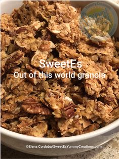 a bowl filled with granola sitting on top of a table