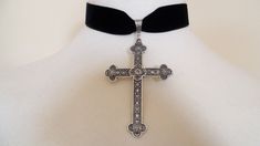 It has a beautiful Large Silver tone cross.The cross is 3" inches ( 7 1/2 cm ) in length.The velvet is approximately 1" ( 2 1/2 cm) wide and on the back you have an extra 2 ½" ( 6 cm) by means of a silver plated extender chain,which fastens with a silver plated clasp or satin tie. Combined shipping on multiple items. PLEASE NOTE: International buyers who pay for Airmail only will NOT get a tracking number as this facility is only available for "International Tracked" Adjustable Cross Choker For Gifts, Cross Choker For Party, Elegant Cross Choker As A Gift, Gift Cross Choker, Elegant Silver Cross Choker, Silver Cross Choker For Party, Halloween Choker, Goth Outfit Inspo, Cross Choker Necklace