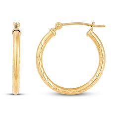 These lovely hoop earrings for her are crafted in classic 14K yellow gold and feature beautiful etched designs. The 20mm earrings secure with hinged backs. Small Hoop Engraved Yellow Gold Earrings, Engraved Yellow Gold Round Hoop Earrings, Engraved Small Hoop Earrings In Yellow Gold, Engraved 14k Yellow Gold Hoop Earrings, Engraved Yellow Gold Hoop Jewelry, Engraved 14k Gold Hoop Earrings, Engraved Yellow Gold Hoop Earrings For Anniversary, 20mm Earrings, Etched Designs