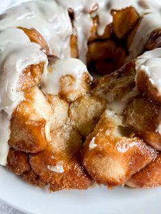 a bundt cake with icing on a white plate