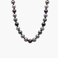 Go for a look of classic sophistication with this strand of darkly lustrous Tahitian pearls. The 18'' length lets it rest beautifully around your neck. Formal Single Strand Tahitian Pearl Necklace, Classic Tahitian Pearl Necklace With Round Beads, Classic Tahitian Pearl Round Bead Necklaces, Classic Tahitian Pearl Round Bead Necklace, Classic Tahitian Pearl Beaded Necklace, Classic Round Tahitian Pearl Necklace, Classic Tahitian Pearl Necklace With High Luster, Formal Black Tahitian Pearl Necklace, Pearl Strands Necklace