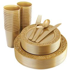 a stack of gold colored plates and cups with golden forks and spoons on them