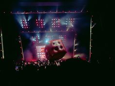 the stage is lit up with red and white lights