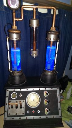 two blue lights sitting on top of a table next to a clock and other items