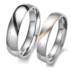 two wedding rings with the word love engraved on each side and gold in between them