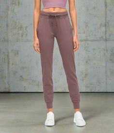 Introducing the Active Stride Women's Joggers – your ultimate go-to for life on the move and active living! These athletic pants are crafted from high-quality, breathable fabric, offering lasting comfort while adding a stylish touch to your wardrobe. Whether you're hitting the gym, going for a run, or enjoying a casual day, they have you covered. The sleek, versatile design seamlessly transitions from workout sessions to brunch, ensuring you look chic for any occasion. With a secure fit and a range of sizes, celebrate your shape and enhance flexibility. Whether running errands or breaking a sweat, they are perfect for every activity. Embrace both style and performance with the Active Stride Women's Joggers, made for women who want it all! Functional Breathable Solid Color Pants, Comfort Stretch Gym Joggers With Pockets, Activewear With Pockets For Jogging, Gym Joggers With Comfort Stretch And Pockets, Comfort Stretch Joggers With Pockets For Gym, Jogging Activewear With Pockets, Breathable Comfort Stretch Sports Pants, Sporty Joggers For Yoga, Sports Yoga Pants With Side Pockets