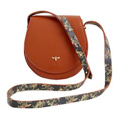 Fable's classic saddle bag has been given a seasonal update. The curved satchel design evokes a sense of country life, reminiscent of a classic equestrian saddle bag but with a magical finish with the application of the Night's Tale print to the strap. This compact cross-body, in tan certified vegan leather, is the perfect carrier to accompany you on your journey through your very own Night's Tale. Wipe clean with damp cloth Cute Satchel Bags, Equestrian Saddle, Fable England, Luxury Christmas Gifts, Twilly Scarf, Perfect Handbag, Moon Collection, Animal Brooch, Harvest Moon