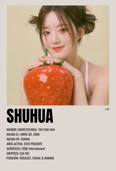 a woman holding an apple in front of her face with the words shuha on it