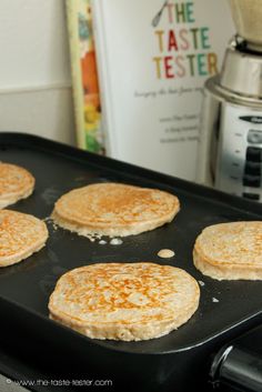 pancakes are being cooked in a pan on the stove