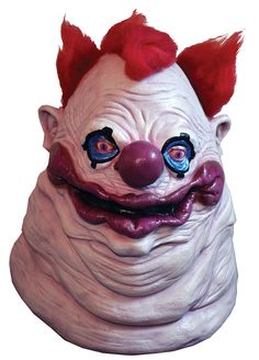 an evil clown mask with red hair and blue eyes