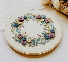 a close up of a embroidery on a table