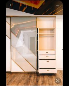 an open closet with drawers and sliding doors