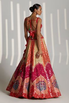 Multicolored applique raw silk lehenga with attached cancan, embroidered with mirror and gota encrusted in tonal silken threads. Paired with sleeveless embroidered, padded blouse and sheer dupatta.
Component: 3
Pattern: Embroidered
Type Of Work: Floral
Neckline: Sweetheart
Sleeve Type: Sleeveless
Fabric: Raw Silk
Color: Multi Color
Other Details: 
Tassel detail
Sheer dupatta
Floral motifs
Occasion: Sangeet,Bride - Aza Fashions Lehenga And Blouse, Raw Silk Lehenga, Vacuum Storage, Parsons School Of Design, Red Blouse, Silk Lehenga, Coral Red, Silk Dupatta, Sweetheart Neck