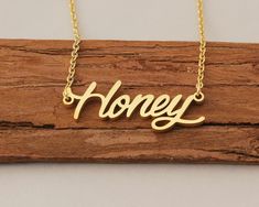 "Custom Name Necklace, Honey Gold Name Necklaces for Women, Personalized Necklace, Nameplate Necklace Engraved Christmas Gift for Girls This necklace is made of Stainless Steel Available color: Gold, Silver and Rose Gold Chain Length: 14\"16\"18\"20\"22\" inches Processing Time: 2-10 business days Standard Shipping: 10-15 business days to USA. 15-30 business days to other countries. Expedited Shipping: 5-8 business days to USA. 5-10 business days to others. Please do not hesitate to contact us w Necklace With Kids Names, Graduation Gifts For Friends, Personalized Gold Necklace, Birthday Necklace Gift, Tiny Necklace, Custom Initial Necklace, Nameplate Necklace, Friendship Necklaces, Gold Name Necklace