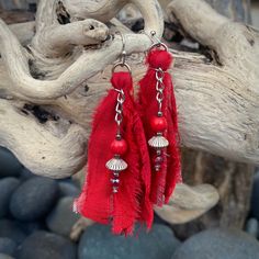 "These beautiful boho inspired earrings are hand-crafted using recycled sari silk and a variety of glass and seed beads.  They are very lightweight and the perfect addition for a casual day or fun night on the town Materials: Sari Silk/Glass, Wood & Metal Beads/Nickel Free Earwire Color: Red Measurements: Drop length approx. 2 3/4\"/Tassel 2\" Weight : 1 gram/.07 oz. (individual earring) Designer: Norma Patridis *Each set of earrings comes boxed ready for gifting* Please note that color may slig Bohemian Beaded Earrings With Latkans For Beach, Bohemian Beaded Latkans Earrings For Beach, Bohemian Beaded Latkan Earrings For Beach, Bohemian Beaded Earrings With Latkans For Summer, Bohemian Dangle Tassel Earrings For Festive Occasions, Red Handwoven Beaded Earrings For Festival, Bohemian Style Festive Dangle Tassel Earrings, Red Bohemian Earrings For Festivals, Traditional Fringe Earrings For Beach