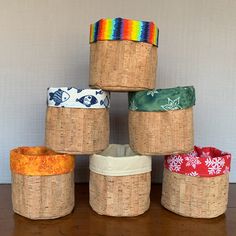 six baskets stacked on top of each other with different patterns and colors in the middle