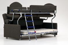 a bunk bed with a couch underneath it and a ladder attached to the back wall