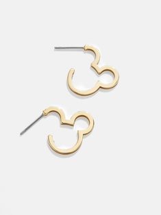 This effortless pairing offers a touch of Disney that's easily addable to your everyday layers. These gold hoops are crafted in the shape of Mickey Mouse's famous facade. Have multiple piercings? Pair with a few other Disney delicates for a fully loaded-up ear stack. This is an officially licensed Disney product. Disney Outline, Disney Gold Earrings For Gift, Baublebar Disney Earrings, Mickey Ear Earrings, Disney Baublebar, Gold Disney Mickey Mouse Jewelry, Disney Mickey Mouse Gold Jewelry, Disney Gold Mickey Mouse Jewelry, Disney Gold